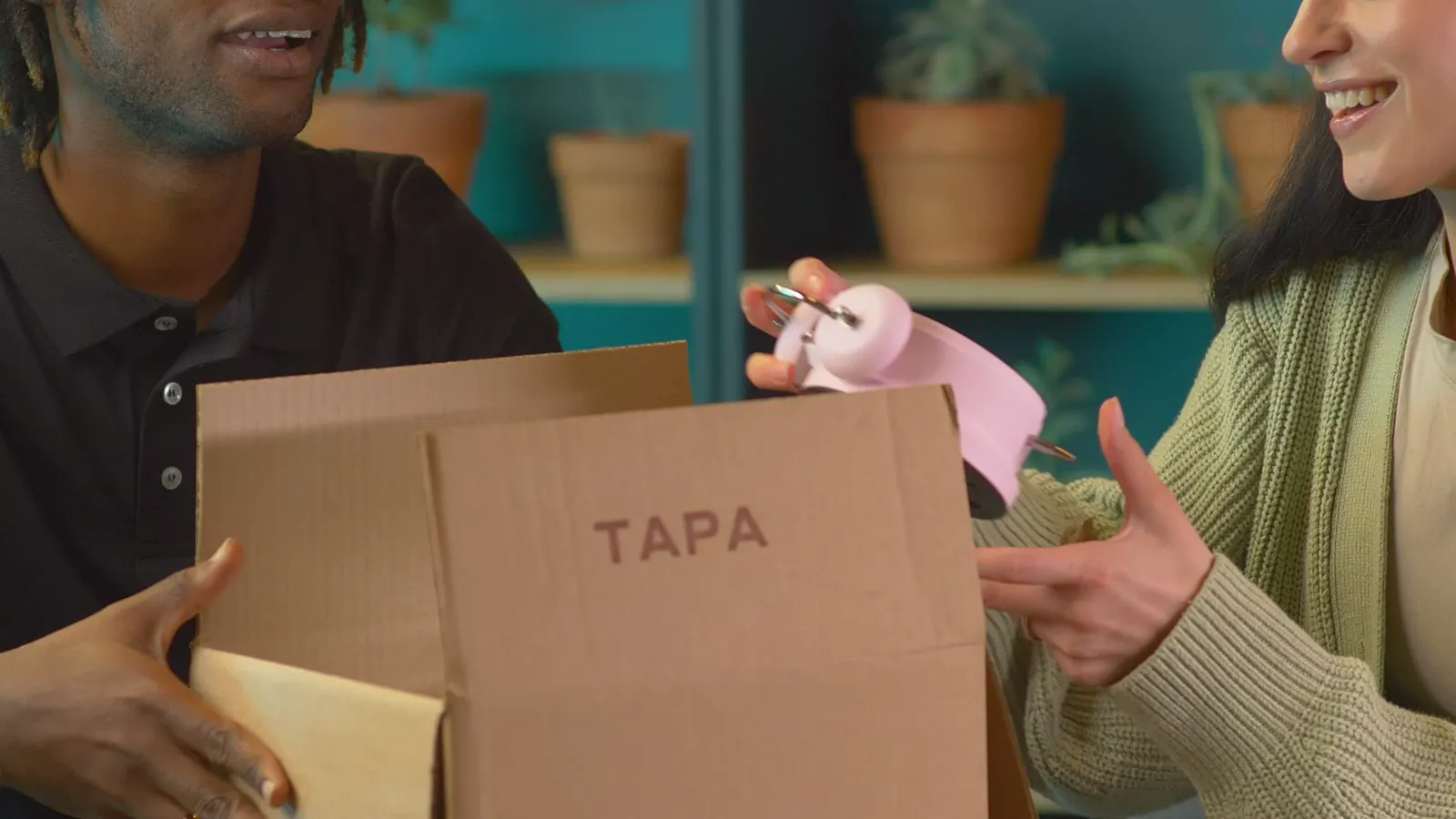 A couple opening a delivered package