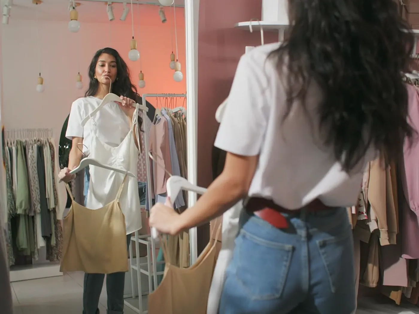 Customer choosing clothes in a boutique